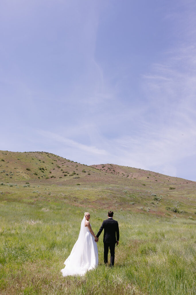 romantic wedding photos of the bride and groom with a mountain backdrop in boise idaho