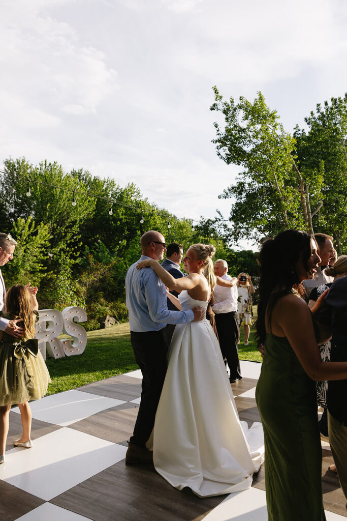outdoor wedding ceremony on the boise river in idaho on a private family estate