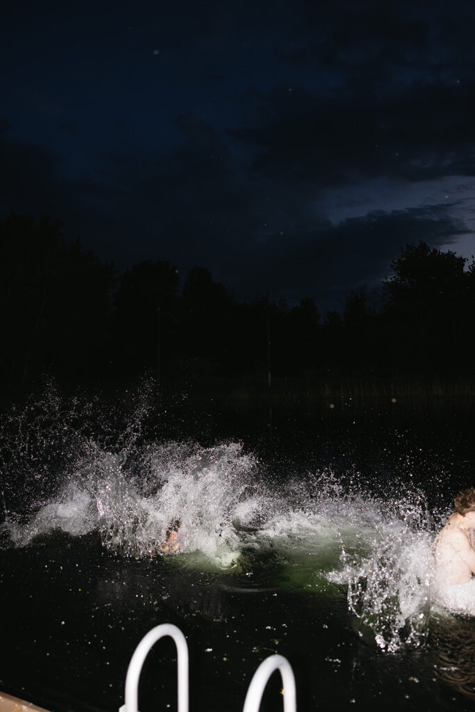wedding party jumping into the boise river after outdoor wedding