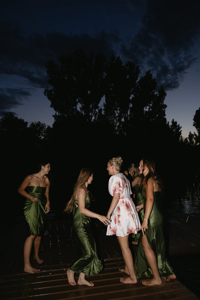 wedding party jumping into the boise river after outdoor wedding