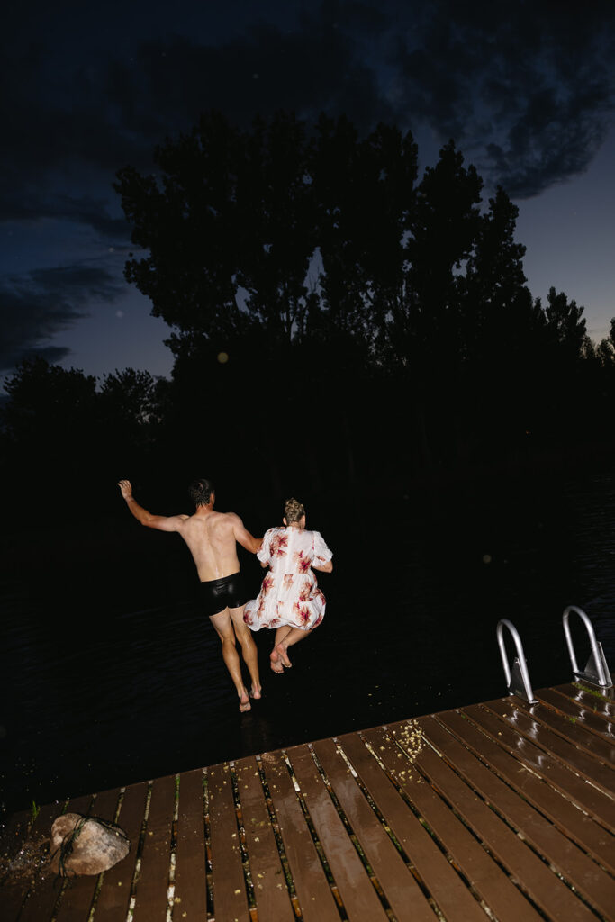 wedding party jumping into the boise river after outdoor wedding