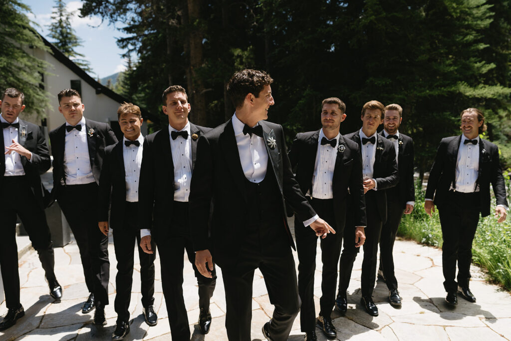 groomsmen candid photo walking together for a wedding in vail colorado